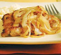 Smothered Pork Chops With Onions And Cheddar Grits