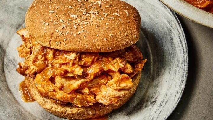 A tangy and tender barbecue pulled chicken sandwich served with creamy coleslaw. A flavorful, comforting meal perfect for weeknights or summer gatherings. #BBQSeason #PulledChicken #ComfortFood #SummerEats #FoodBloggers #HomeCooking #SandwichLove #FarmersMarketWeek