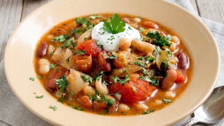 Thick, hearty, and deeply satisfying. This classic peasant stew packs rich tomatoes, tender white beans, and aromatic garden herbs into a bowl of pure rustic warmth. #PeasantStew #CozyKitchen #WinterSoups #ComfortFoodCraft #HealthyRecipes #RusticEats #BeanStew #EasyDinnerIdeas #FoodBloggerLife
