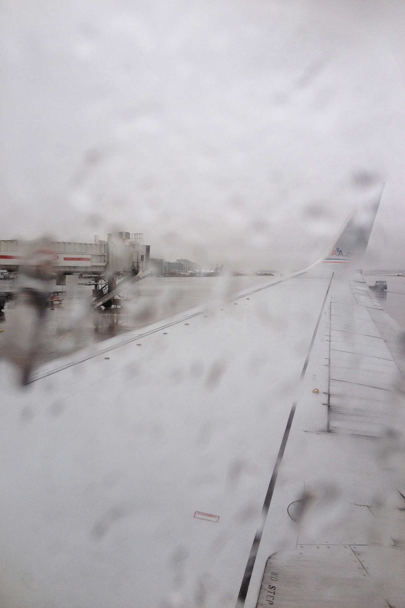 Raining out of the window of the plane in Miami, Florida
