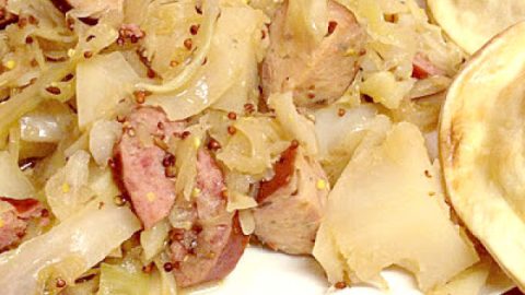 Beer Braised Sausage and Kraut is a hearty and delicious meal that's perfect for a chilly day.  It's one of our favorite cold weather meals.