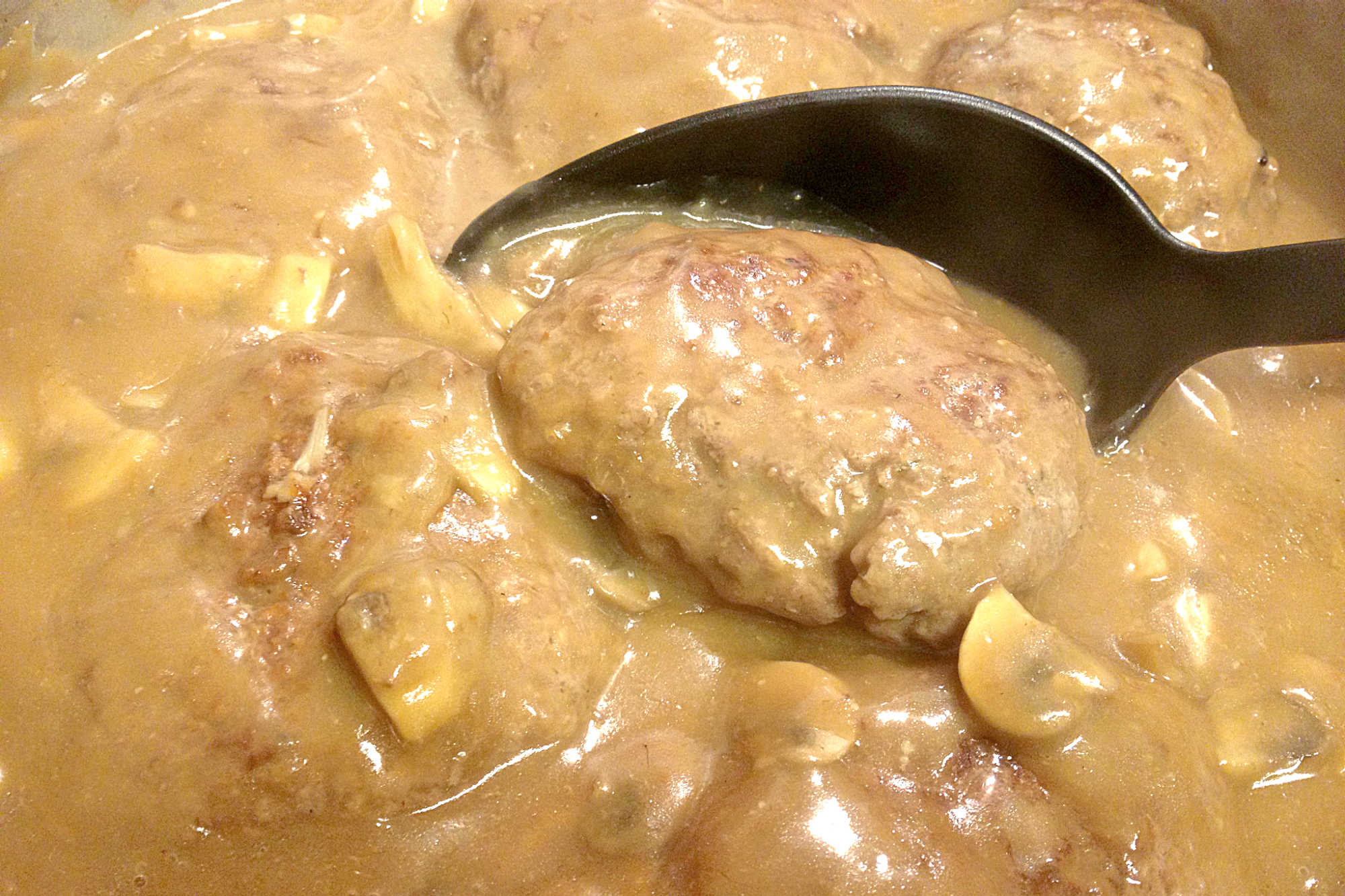 Experience the rich flavors of Hot Hamburger (Salisbury Steak) with this simple and satisfying dish. Each patty is cooked to perfection and topped with flavorful gravy, making it ideal for quick weeknight meals or special occasions. #BurgerMonth #HotHamburger #SalisburySteak #ComfortFoodie #FoodieFaves #MeatloversUnite