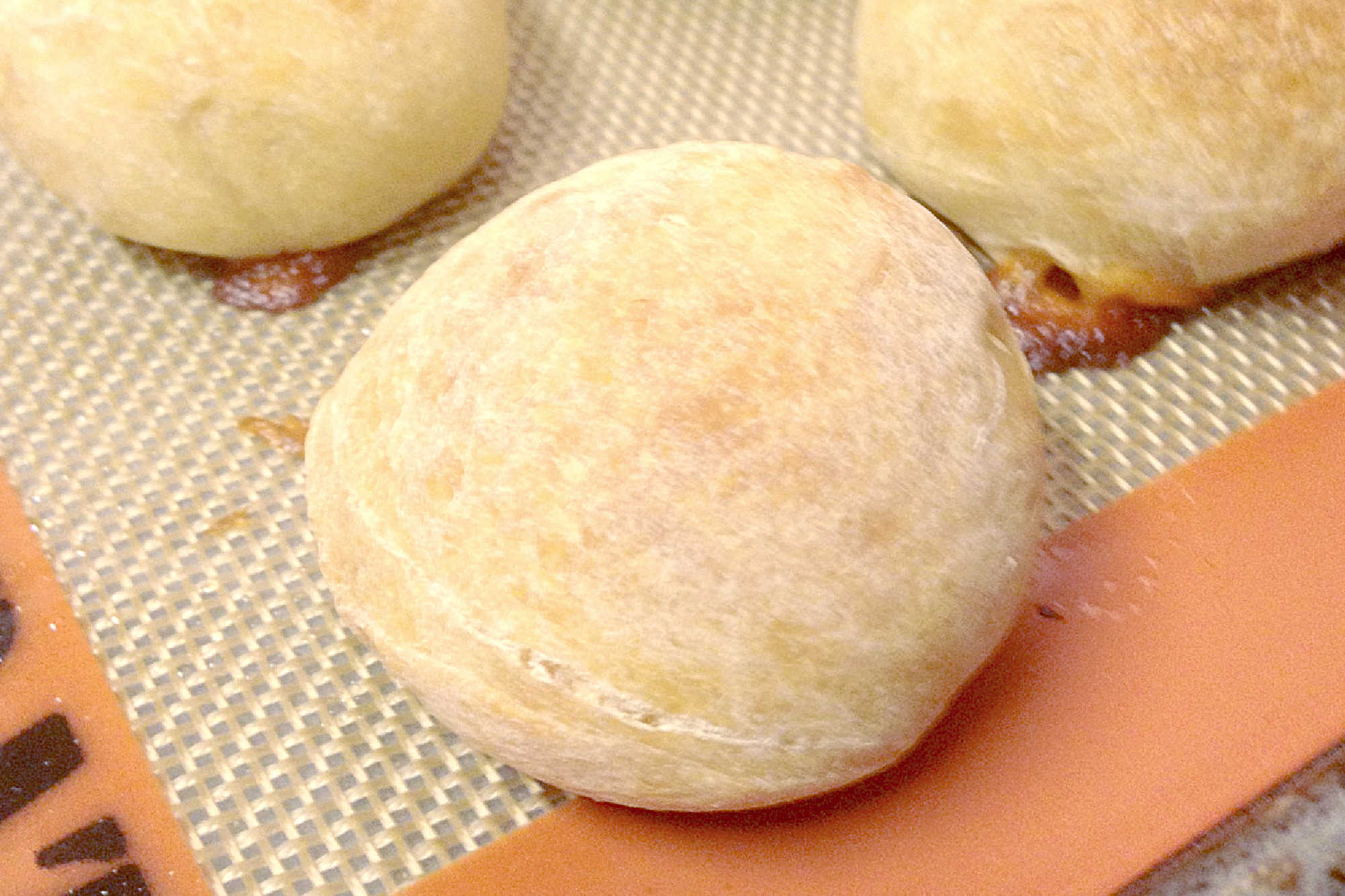 These Mozzarella Stuffed Wheat Rolls are soft, wholesome, and feature the best gooey mozzarella pull. Perfect with soup or as an appetizer! #mozzarellarolls #wholewheat #homemaderolls #bakingrecipe #foodblogger #cheesepull