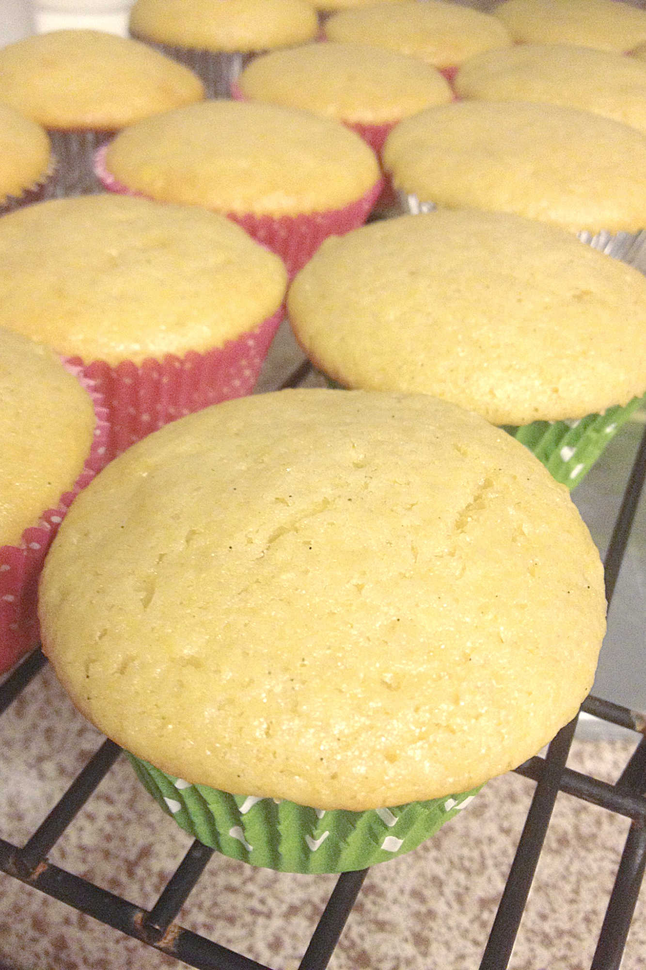 Can't make it to a tropical beach this summer? Bring the flavors of paradise to your kitchen with these delicious Pina Colada Cupcakes! #pineappleparadise #cupcakelove #tropicaltreats #coconutcravings #boozybites
