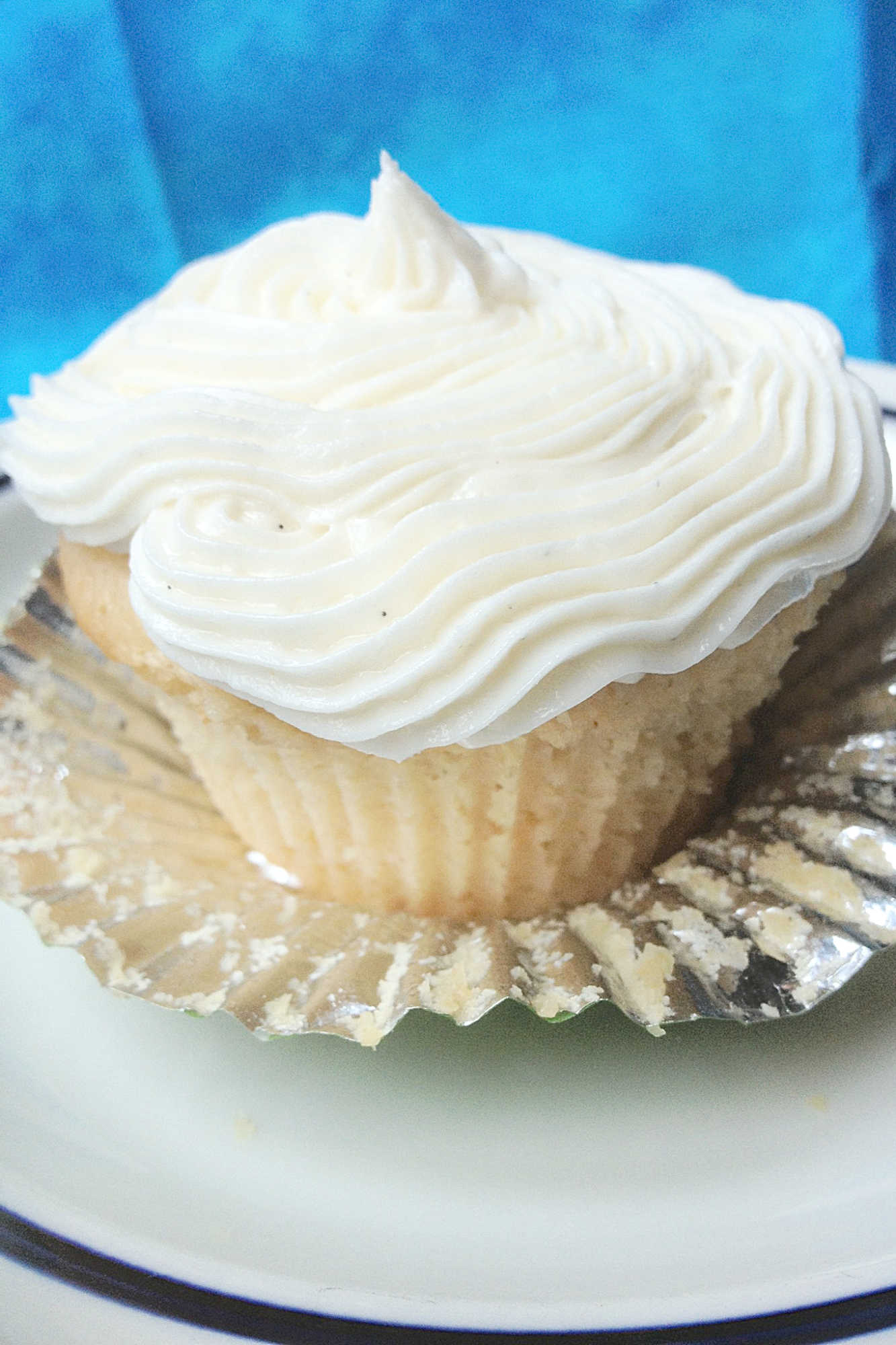 Can't make it to a tropical beach this summer? Bring the flavors of paradise to your kitchen with these delicious Pina Colada Cupcakes! #pineappleparadise #cupcakelove #tropicaltreats #coconutcravings #boozybites
