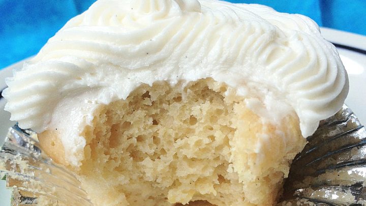 Can't make it to a tropical beach this summer? Bring the flavors of paradise to your kitchen with these delicious Pina Colada Cupcakes! #pineappleparadise #cupcakelove #tropicaltreats #coconutcravings #boozybites