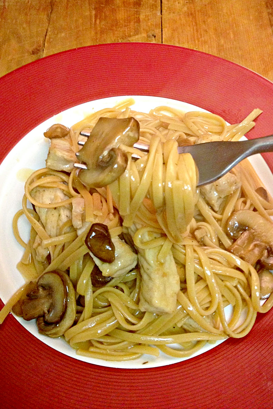 Rich pork Marsala sauce coats pasta and mushrooms.