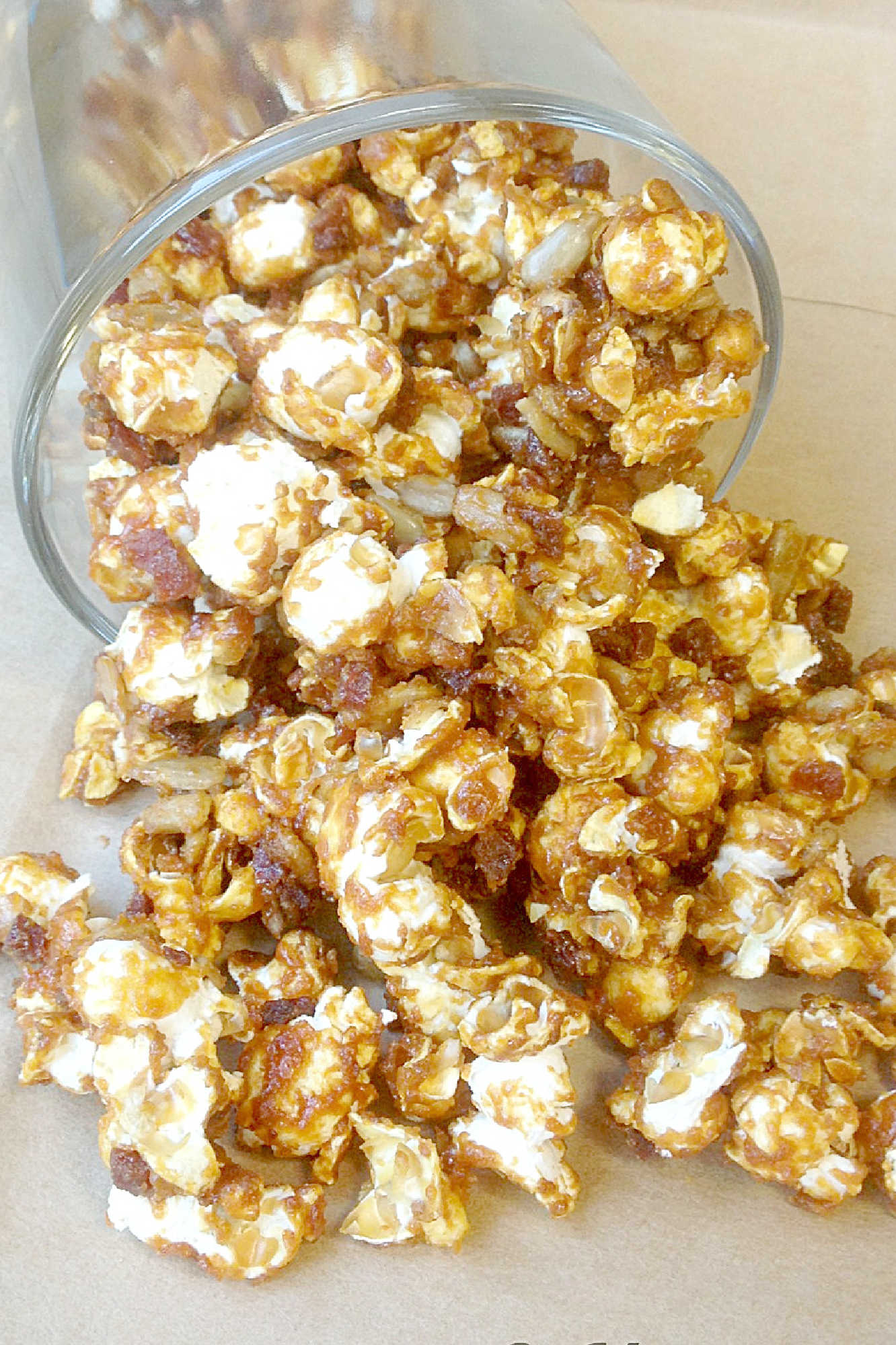 Beer bacon caramel corn brings together salty bacon, sweet caramel, and a hint of beer for a snack that's both surprising and satisfying. Try this unforgettable treat with your next movie night. #BeerBaconCaramelCorn #BrewsAndSnacks #CraftBeerTreats #PorkAndPoppinCandy #FoodieFavs