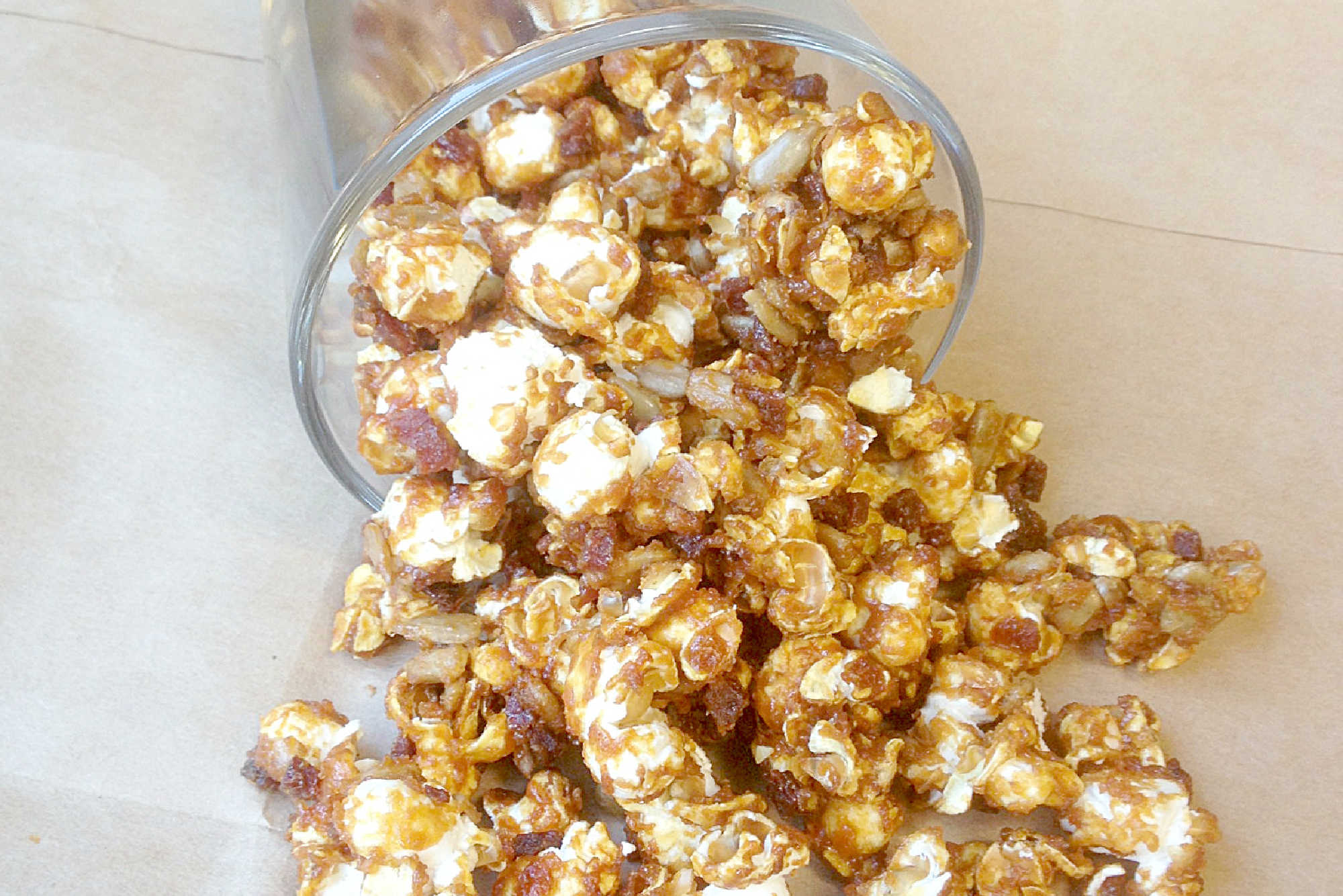 Beer bacon caramel corn brings together salty bacon, sweet caramel, and a hint of beer for a snack that's both surprising and satisfying. Try this unforgettable treat with your next movie night. #BeerBaconCaramelCorn #BrewsAndSnacks #CraftBeerTreats #PorkAndPoppinCandy #FoodieFavs