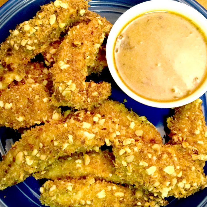 Hands down.  This combination of toasted panko and peanuts is crunchy.  It's very crunchy.  It's crazy tasty crunchy!  Which makes these Crunchy Crusted Chicken Strips with Chipotle Honey Mustard super tasty crazy crunchy.