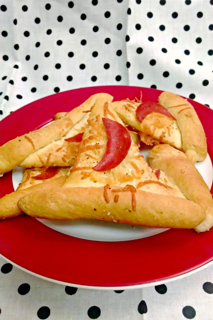 Witch Hats are quick to whip up with ingredients you probably already have. Some crescent roll dough, pepperoni, and Parmesan cheese make up these simple and tasty treats for Halloween.