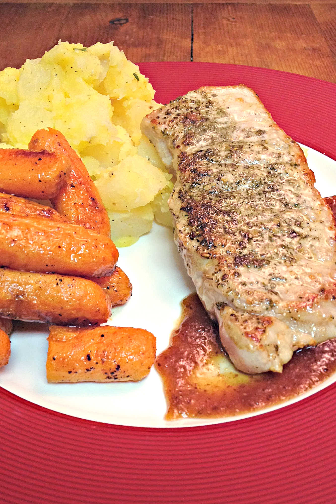 Bring restaurant-style cooking to your kitchen with pork chops with Port Wine Fig Sauce. Thick, juicy chops are topped with a sauce made from rich port wine and sweet figs. #PorkChops #PortWineSauce #FigFeast #GourmetGrub #MeatLoversDelight