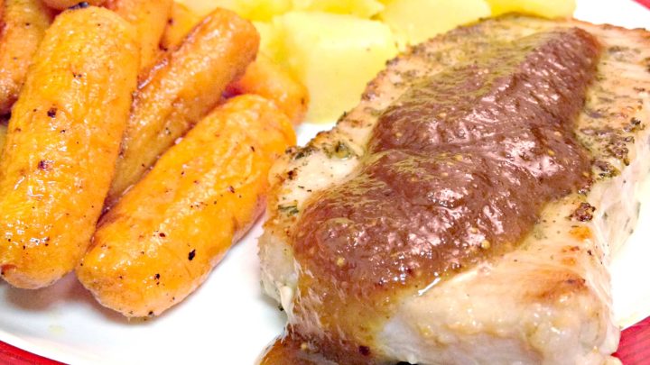 Bring restaurant-style cooking to your kitchen with pork chops with Port Wine Fig Sauce. Thick, juicy chops are topped with a sauce made from rich port wine and sweet figs. #PorkChops #PortWineSauce #FigFeast #GourmetGrub #MeatLoversDelight