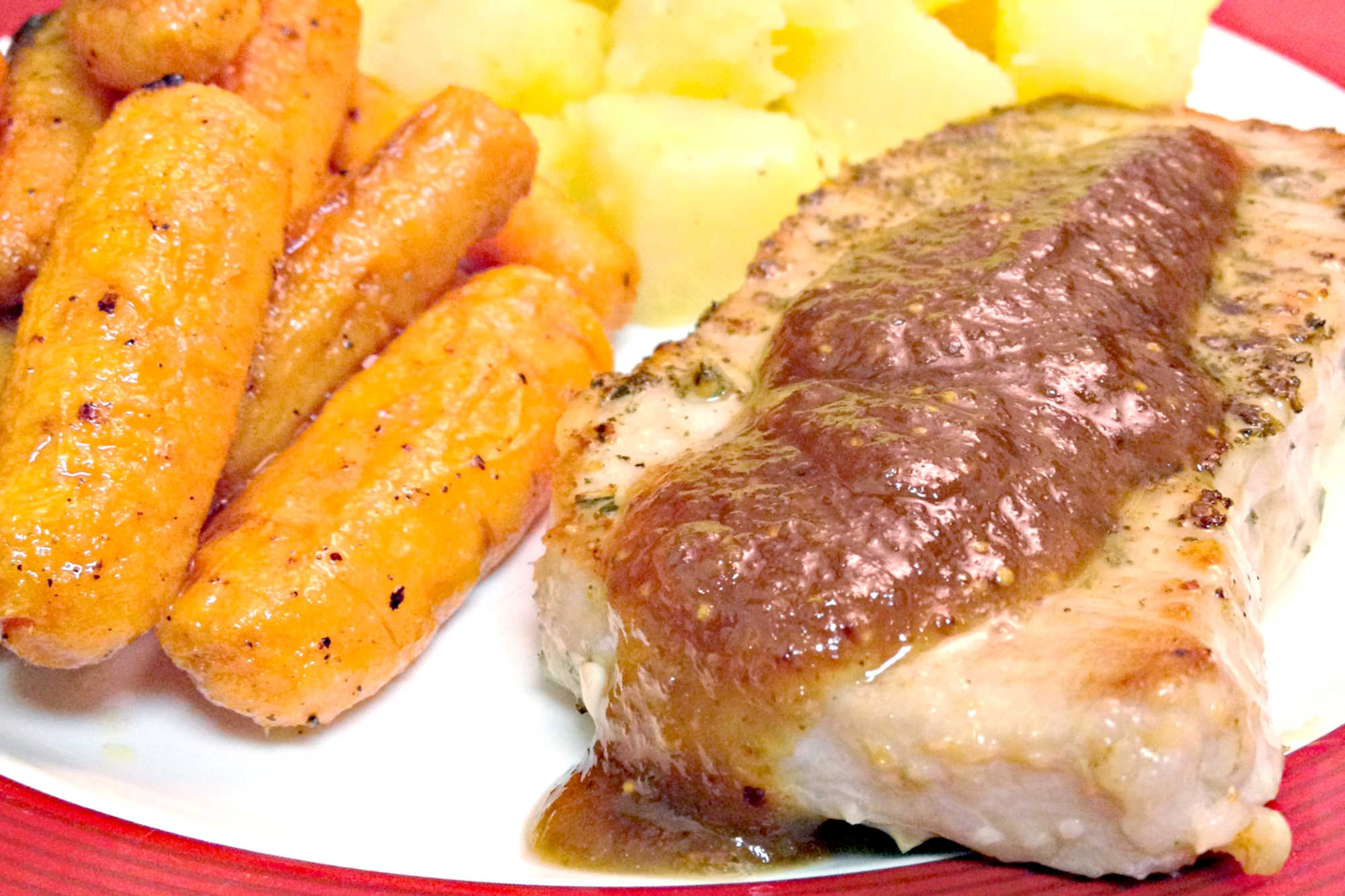 Bring restaurant-style cooking to your kitchen with pork chops with Port Wine Fig Sauce. Thick, juicy chops are topped with a sauce made from rich port wine and sweet figs. #PorkChops #PortWineSauce #FigFeast #GourmetGrub #MeatLoversDelight