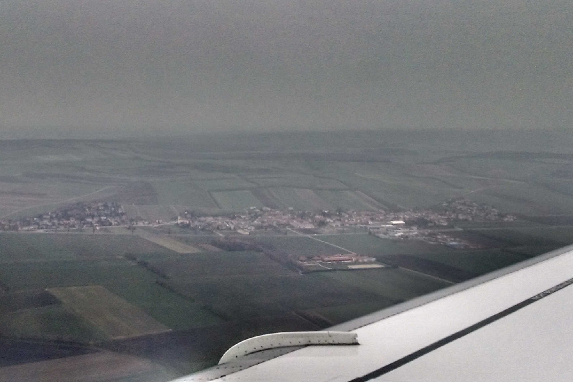 The Fog in Bosnia makes for an early departure home with a delicious soft pretzel, interesting coat hook, and interesting airline dinner.