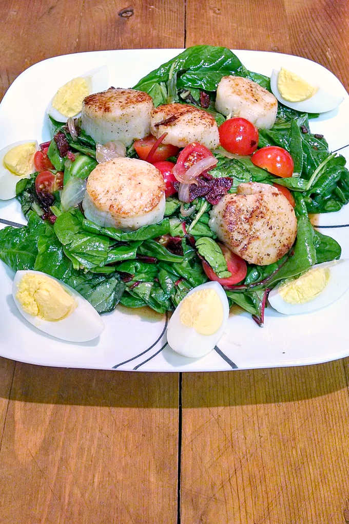 A wilted spinach salad gets a makeover with the addition of pan seared scallops.  BLTS Salad has the sweet and sour of the wilted lettuce salad with tangy tomatoes, salty bacon, and sweet scallops.  It’s a great dinner salad for any night of the week.
