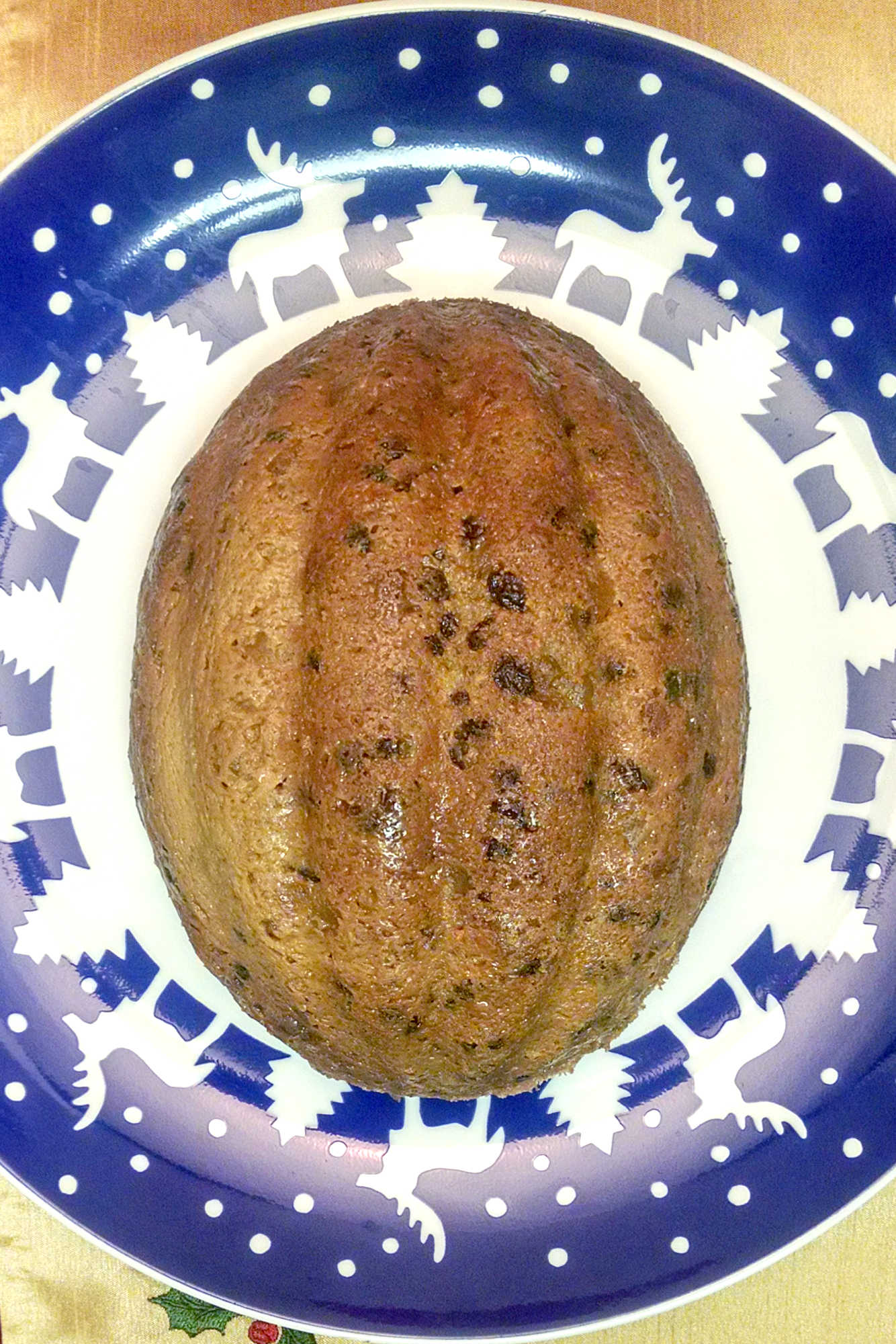 Tired of the same old holiday desserts?  Try Mum Lowe's Christmas Pudding, an English inpsired steamed pudding.  Filled with delicious fruit, raisins, and spices it was always on our holiday table and once you try this recipe it will be on yours, too! #ChristmasPuddingRecipe #FamilyRecipes #HolidayBaking #TraditionalDesserts #EasyHolidayCooking #Christmas #DessertIdeas #ChristmasTraditions #HolidayCooking #HolidaySweets #FestiveFlavors