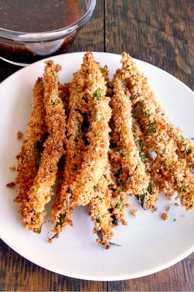 The trick to getting super crispy Oven-Fried Green Beans is toasting the panko. It gives that super crunchy fried taste without all that fat and oil making them a healthier version of the popular appetizer.