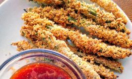 The trick to getting super crispy Oven-Fried Green Beans is toasting the panko. It gives that super crunchy fried taste without all that fat and oil making them a healthier version of the popular appetizer.
