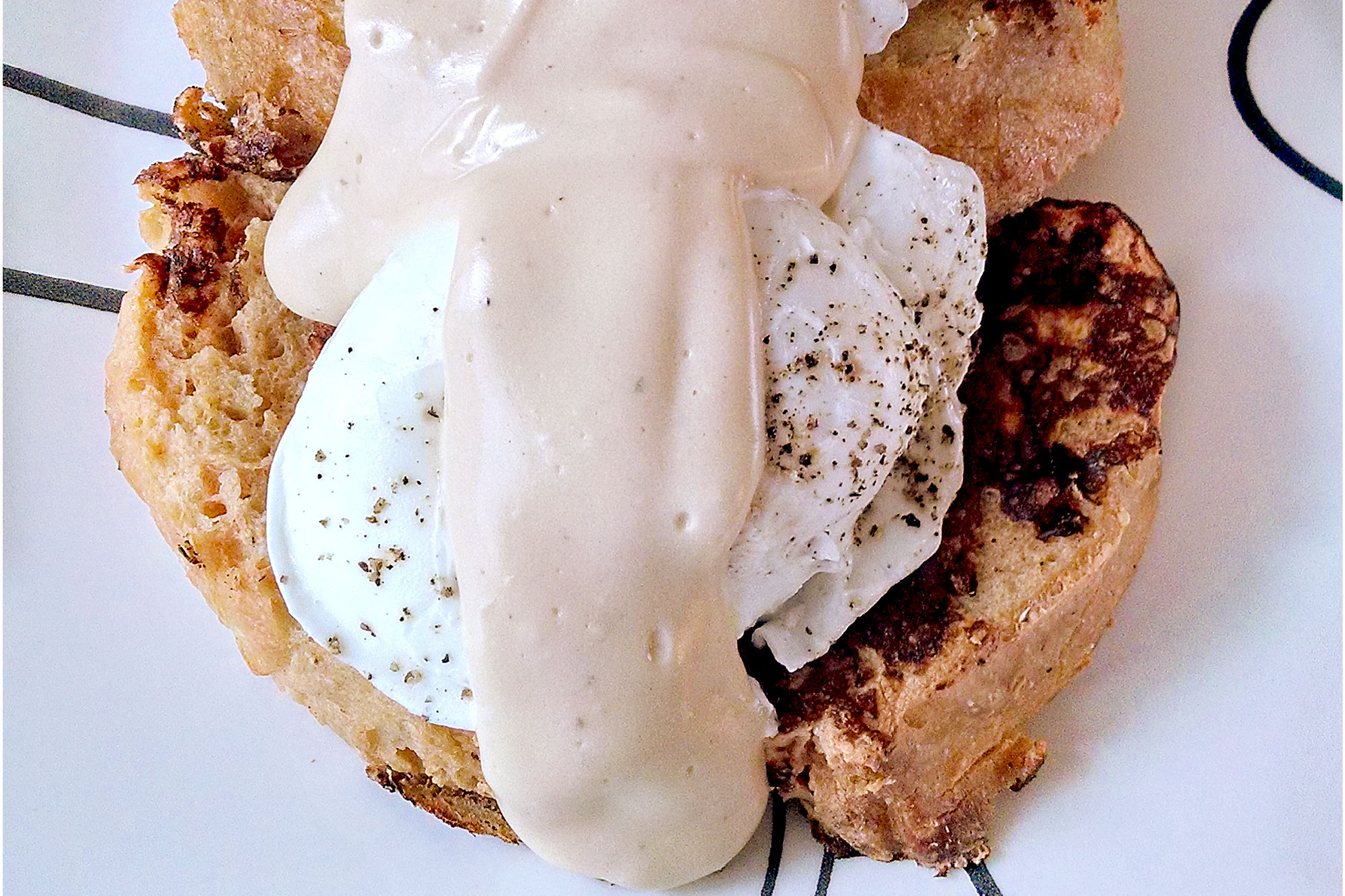 Savory French toast is not only different, but is amazingly tasty! This Tomato Parmesan Pain Perdu with Poached Eggs and Rarebit Sauce is hearty enough for any meat eater.