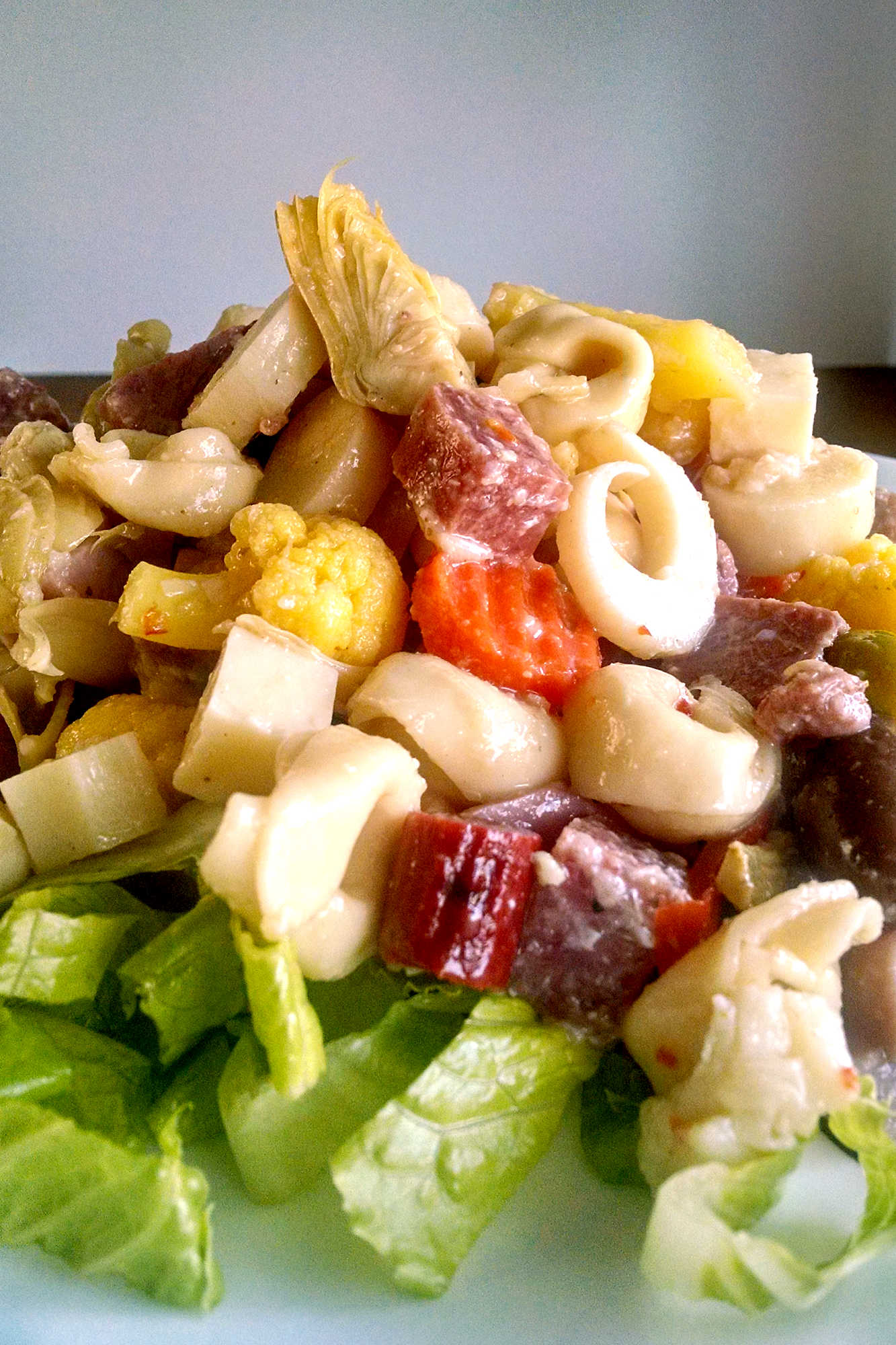 Looking for a crowd-pleasing dish to bring to your next BBQ? Look no further than this tasty Muffaletta Pasta Salad. Tangy, savory, and oh-so-easy to make. #BBQEssentials #MuffalettaPasta #SummerSideDish #FoodieFridays #MuffalettaLove #RecipeIdeas #MuffalettaPastaSalad #DeliciousDishes  #SummerVibes#MuffalettaPastaSalad #PastaSaladLovers #DeliciousDeliDish #FoodieFavs #SummerSides