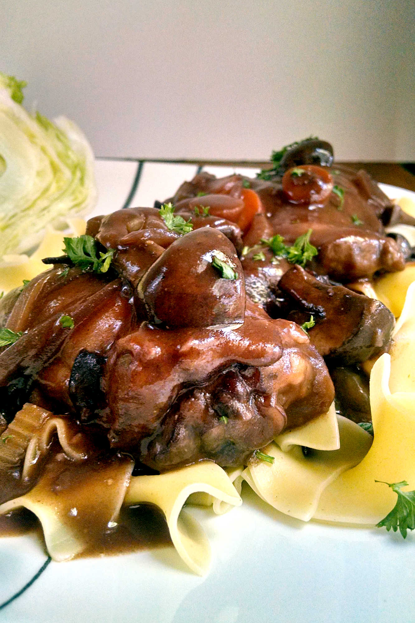 Coq au Vin is the ultimate French comfort food that will have you feeling like you're dining in a cozy bistro in Paris. Bon appétit! #coqauvinrecipe #frenchcuisineinspo #wineloverfavorites #dinnerpartydish #deliciousandfancy #FrenchCuisine #CoqauVin #ComfortFood