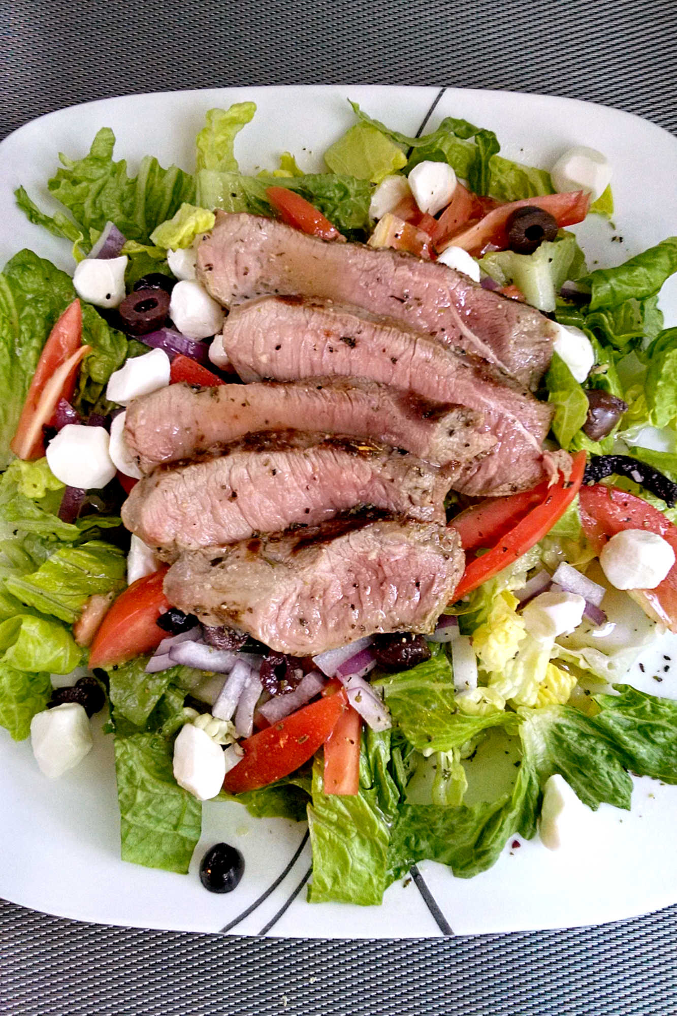 Indulge in a taste of Italy with this Steak Caprese Salad.🥩🥗 Bursting with fresh mozzarella, ripe tomatoes, and tangy balsamic, this dish will transport your taste buds to the streets of Rome. #SteakCapreseSalad #SaladLoversUnite #FoodieFinds #GourmetGrub #Foodie #ItalianDelight #SteakCapreseSalad #SteakLovers #HealthyEats #FoodieFavs #SummerSaladSensation