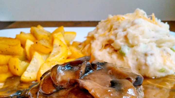 Hearty, tasty, and worthy of a Father's Day Meal, this Salisbury Steak with Loaded Mashed Potatoes and Mushroom Gravy is easy and tasty. He'll think you've cooked ALL day!