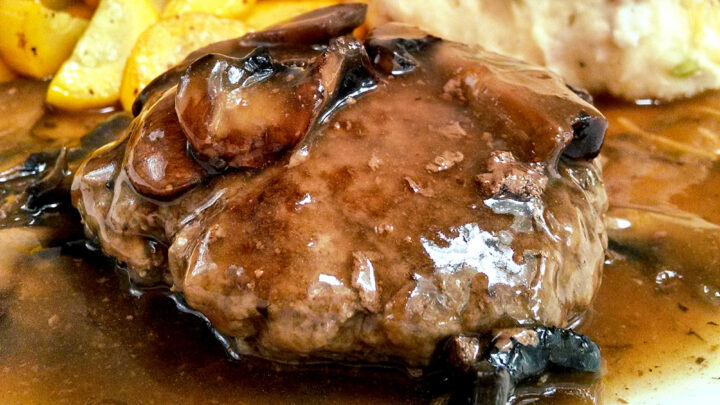 Get ready to indulge in the ultimate comfort food with this Salisbury Steak with Loaded Mashed Potatoes and Mushroom Gravy. Your taste buds will thank you. #comfortfoodie #homemadewithlove #mashedpotatolove #steakdinnerdelight #foodpornheaven