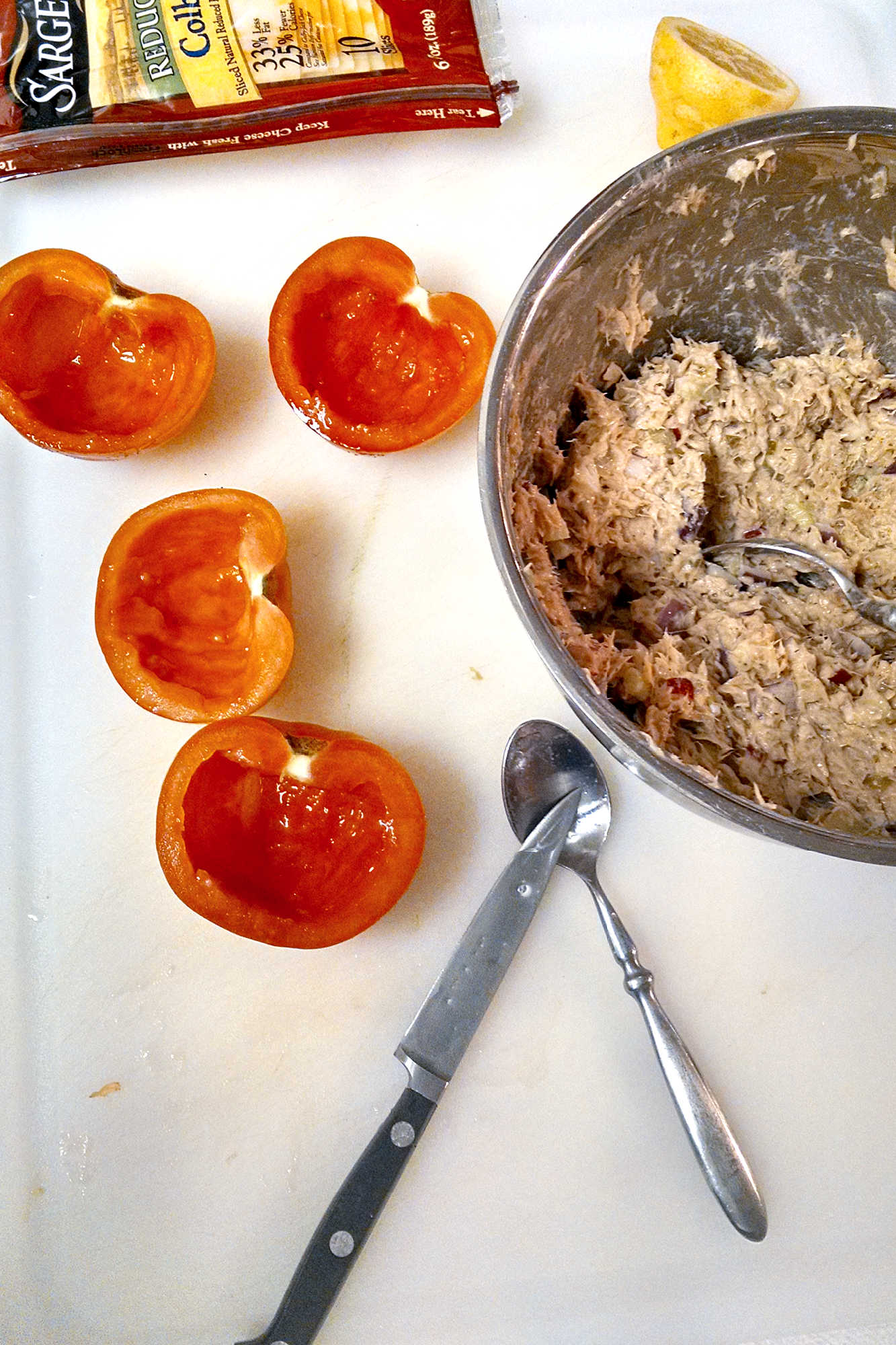 Upgrade your salad game with these protein-packed tuna melt stuffed tomatoes. Perfect for a quick and easy meal. #TunaMeltTuesday #HealthyEating #TunaMeltTomatoes #StuffedTomatoes #HealthyEats #TunaLovers #EasyRecipes