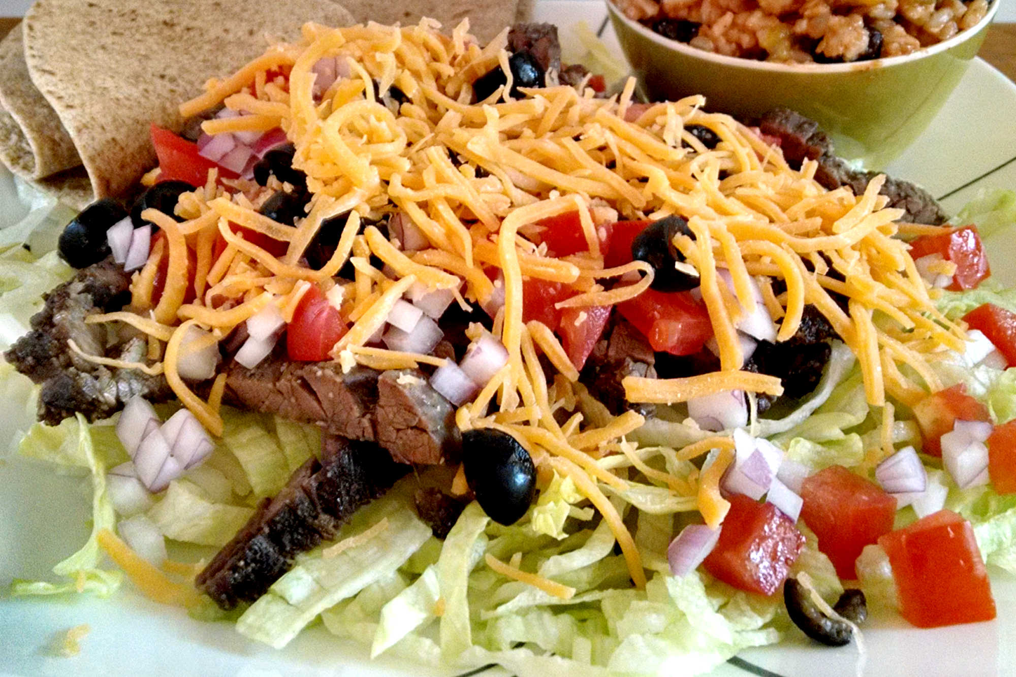 Why settle for plain old salad when you can have a mouthwatering Salt And Pepper Steak Taco Salad? Take your taste buds on a journey with this Asian-inspired taco salad. #SaltPepperSteak #TacoSalad #Foodie #SteakLovers #HealthyEating #DinnerInspo #TacoTuesday #AsianFlavorsInEveryBite #SaltAndPepperTacoSalad #AsianFoodiesUnite #TacoTuesdayDoneRight #EastMeetsWestCuisine #Savory #TexMex #HealthyRecipes #Steak