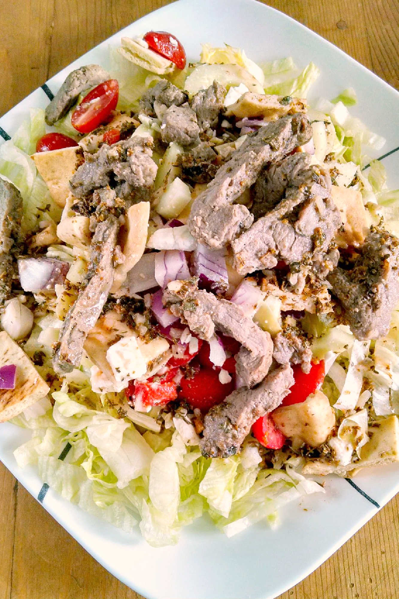 Spice up your salad game with a Pita Panzanella Salad with Steak! Juicy steak, fresh veggies, and a tangy dressing make for a mouthwatering meal. #PitaPanzanellaSalad #SteakSalad #HealthyEats #FoodieFavorites #CarnivoreCravings #SaladGoals #PitaPanzanella #SteakLovers #SaladLovers #MediterraneanEats #ForkAndKnifeDiaries