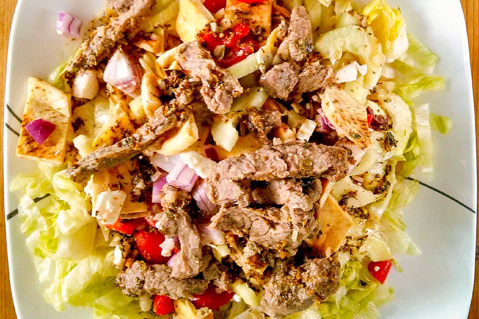 Spice up your salad game with a Pita Panzanella Salad with Steak! Juicy steak, fresh veggies, and a tangy dressing make for a mouthwatering meal. #PitaPanzanellaSalad #SteakSalad #HealthyEats #FoodieFavorites #CarnivoreCravings #SaladGoals #PitaPanzanella #SteakLovers #SaladLovers #MediterraneanEats #ForkAndKnifeDiaries