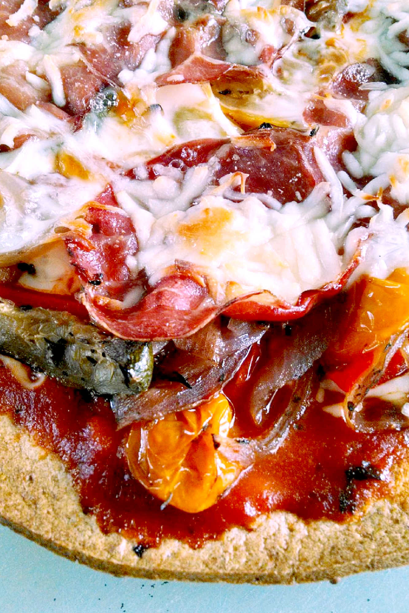 Looking for a flavorful and colorful pizza? Look no further than our Capicola Roasted Veggie Pizza! Savor the deliciousness of roasted veggies, savory capicola, and gooey cheese. #MeatlessMondayPizza #PizzaLoversUnite #PizzaCraze #PizzaLoversUnite #RoastedVeggieDelight #CapicolaCravings #FoodieFaves #InstaPizzaGuru