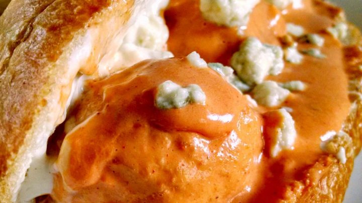 Slow Cooker Buffalo Chicken Meatball Sliders tasty amazing and perfect for any tailgate party. Spicy wing sauce is mixed with cool ranch dressing and poured over these Buffalo chicken meatballs which are slow cooked and perfect for your tailgate party!