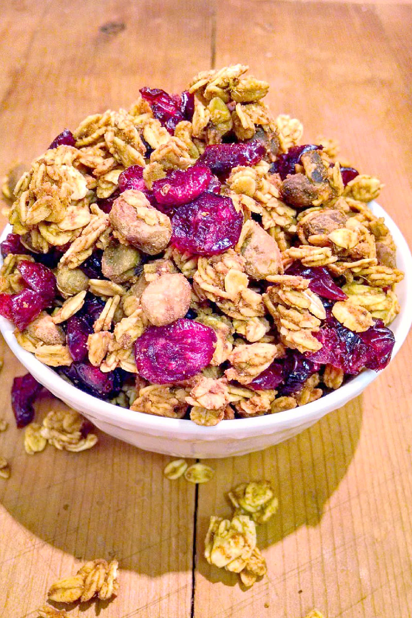 Pumpkin spice and everything nice, this Pumpkin Pistachio Granola is the perfect fall treat! Try it on top of yogurt or by itself for a delicious and healthy snack. #pumpkinpistachiogranola #fallflavors #healthybreakfast #veganrecipes #homemadegranola