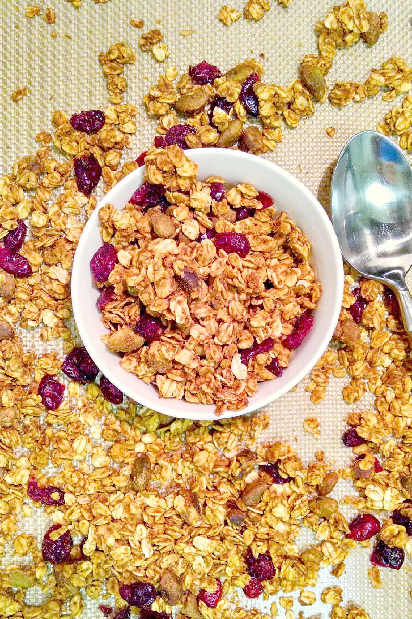 Pumpkin spice and everything nice, this Pumpkin Pistachio Granola is the perfect fall treat! Try it on top of yogurt or by itself for a delicious and healthy snack. #pumpkinpistachiogranola #fallflavors #healthybreakfast #veganrecipes #homemadegranola