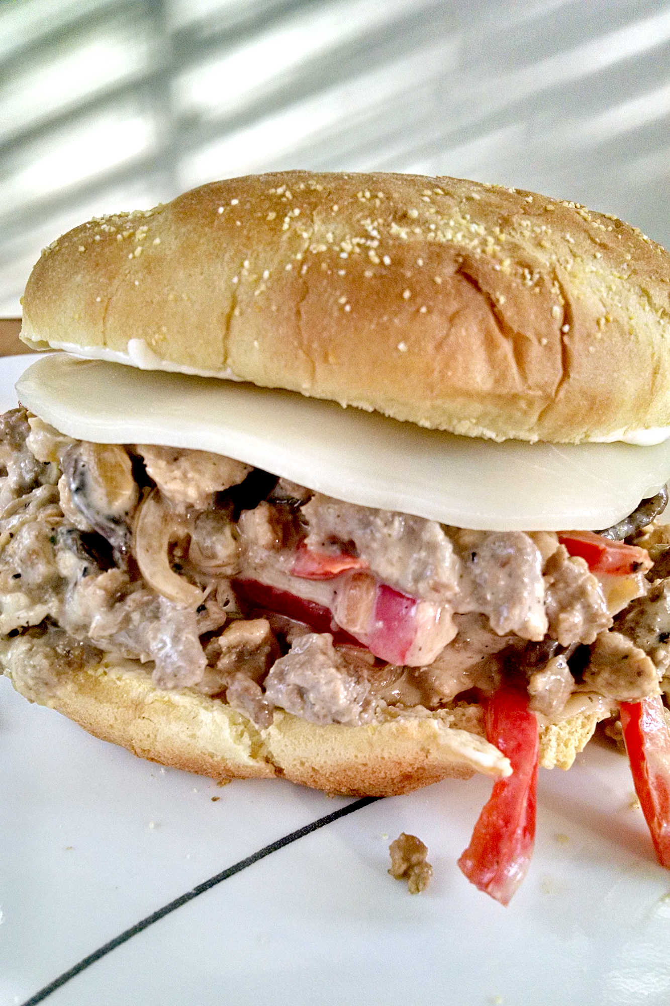 Add a little Philly flair to your next meal with our Turkey Cheesesteak Sloppy Joes. The perfect combination of savory, sweet, and cheesy, you won't be able to resist! #TurkeyCheesesteakSloppyJoes #CheesesteakLovers #FoodieFaves #EasyDinnerIdeas #SandwichObsessed #phillyflavor #weeknightmeal #turkeycheesesteak #sloppyjoes