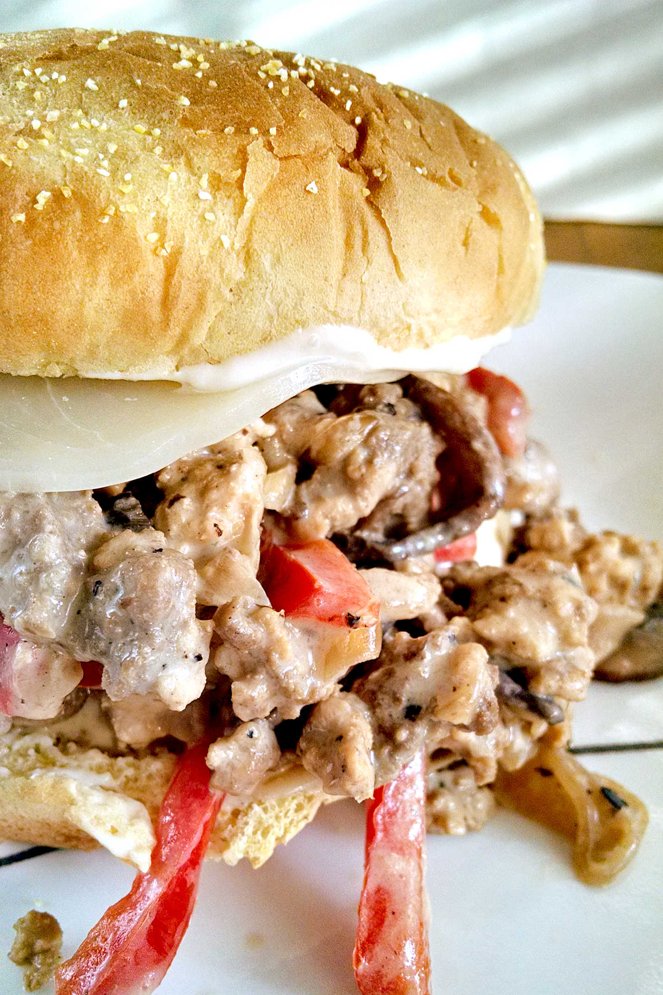 Add a little Philly flair to your next meal with our Turkey Cheesesteak Sloppy Joes. The perfect combination of savory, sweet, and cheesy, you won't be able to resist! #TurkeyCheesesteakSloppyJoes #CheesesteakLovers #FoodieFaves #EasyDinnerIdeas #SandwichObsessed #phillyflavor #weeknightmeal #turkeycheesesteak #sloppyjoes