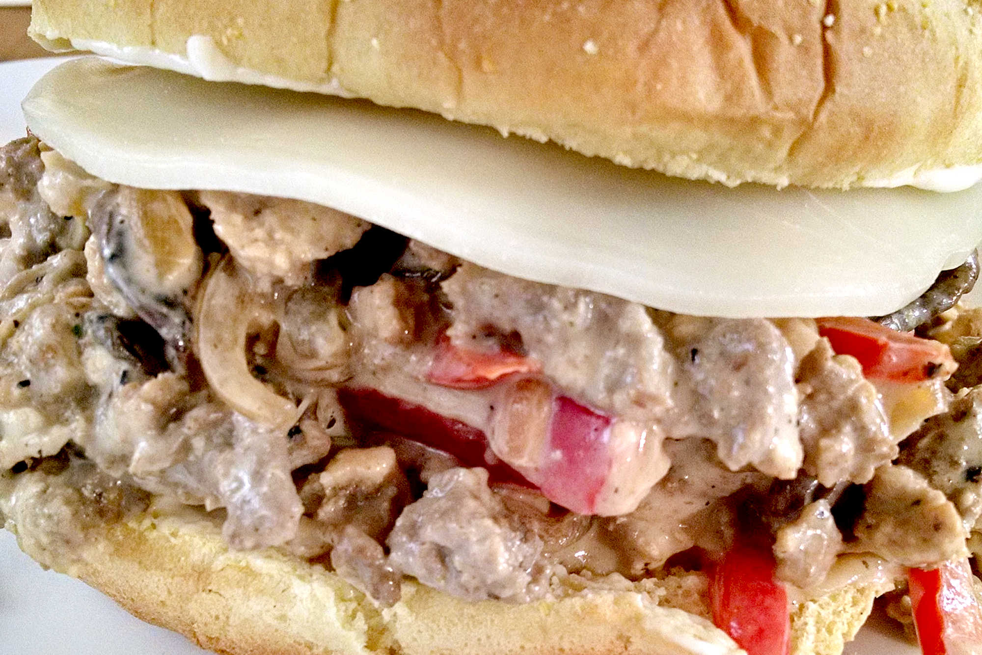 Add a little Philly flair to your next meal with our Turkey Cheesesteak Sloppy Joes. The perfect combination of savory, sweet, and cheesy, you won't be able to resist! #TurkeyCheesesteakSloppyJoes #CheesesteakLovers #FoodieFaves #EasyDinnerIdeas #SandwichObsessed #phillyflavor #weeknightmeal #turkeycheesesteak #sloppyjoes