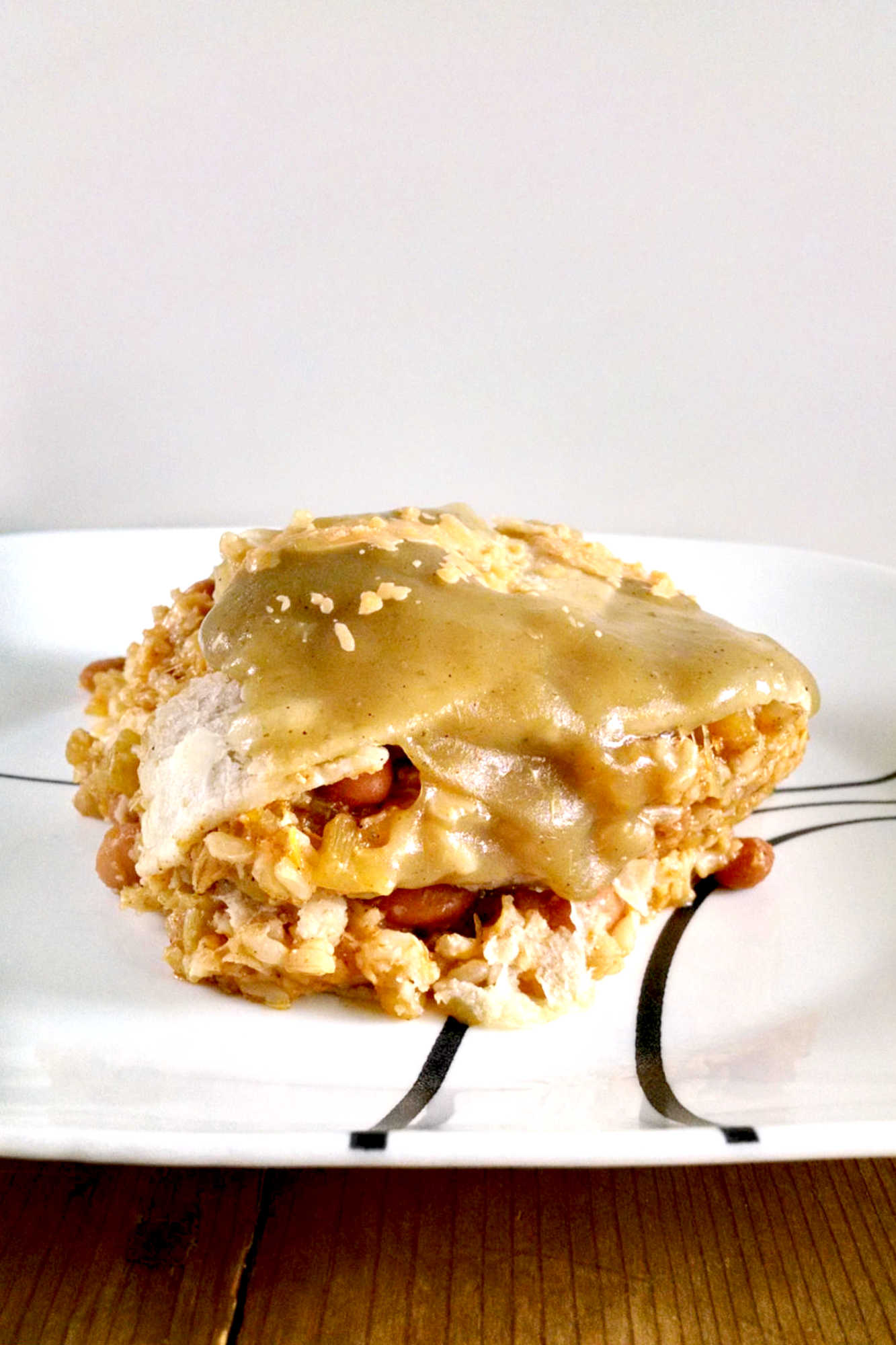 Looking for a new way to use zucchini and pinto beans? This casserole is packed with flavor and nutrients. Perfect for a #meatlessmeal or a side dish!  #MeatlessMondayCasserole #VegetarianComfortFood #HealthyFamilyEats #ZucchiniLovers #PintoBeanPower