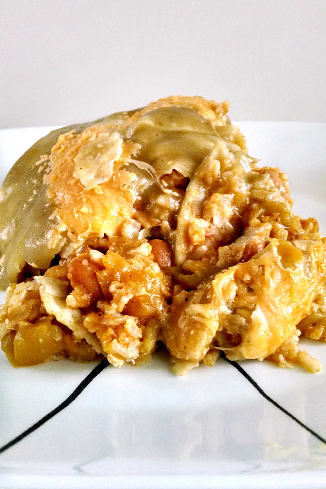 Looking for a new way to use zucchini and pinto beans? This casserole is packed with flavor and nutrients. Perfect for a #meatlessmeal or a side dish!  #MeatlessMondayCasserole #VegetarianComfortFood #HealthyFamilyEats #ZucchiniLovers #PintoBeanPower