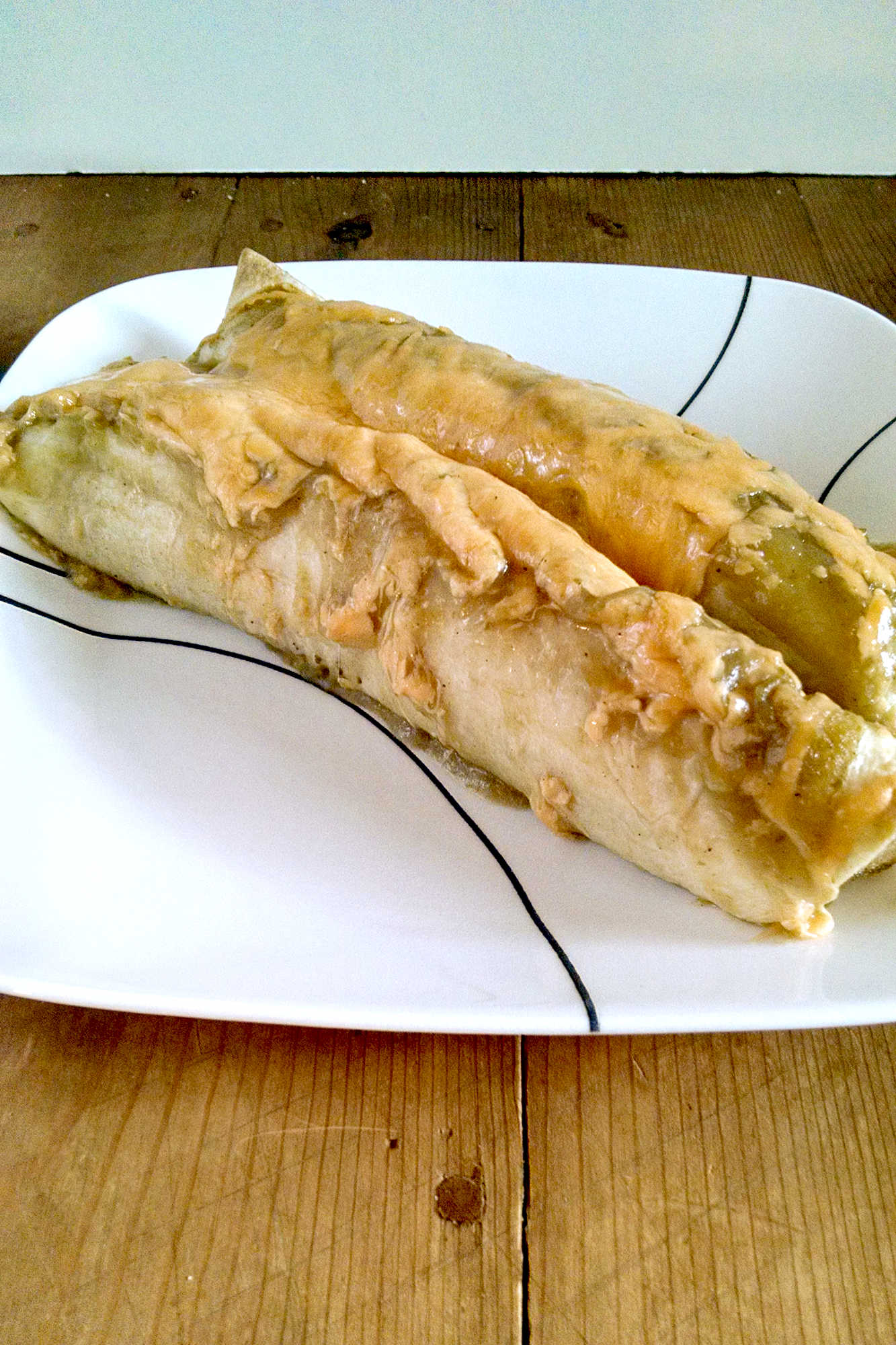Step up your #meatfree game with these delicious and easy to make Zucchini and Hatch Chile Enchiladas! Perfect for a quick and flavorful dinner option.  #ZucchiniEnchiladas #HatchChile #MeatlessMonday #VegetarianRecipes #MexicanFoodLover #healthyeating #MexicanFood