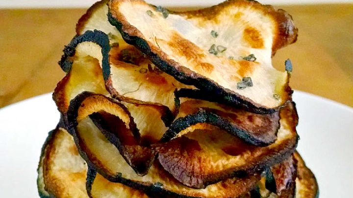 Spicy Black Radishes Chips are baked up into a crispy, delicious chip. If you can’t find black radishes, you could use daikon or any other large radish. Cooking times may vary with other types of radishes. #HealthySnacks #PlantBasedEats #SnackTimeSatisfaction #VeganChips #CrunchyDelight