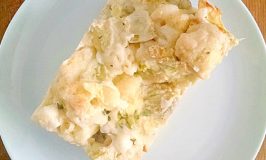 Also called savory bread puddings, stratas are a hearty and inexpensive meal. This Artichoke and Leek Strata is perfect for a delicious #MeatlessMonday meal.