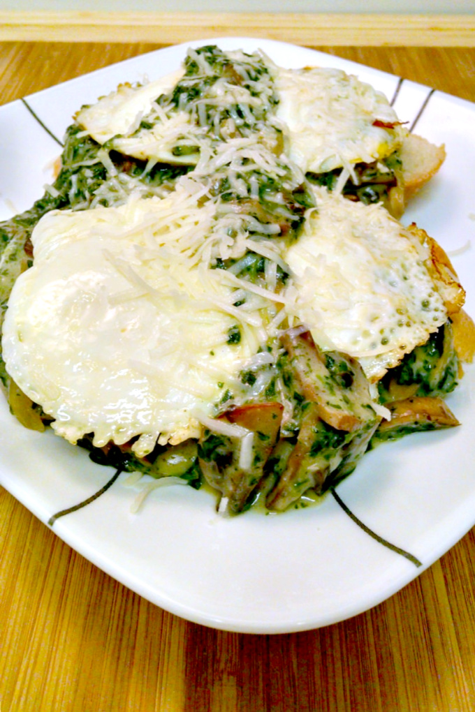 Creamed Chipped Spinach and Mushrooms Over Toast is served over toast with a couple of fried eggs making for a deliciously different breakfast for dinner meal.