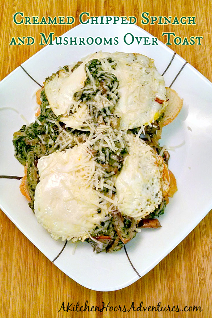 Creamed Chipped Spinach and Mushrooms Over Toast is served over toast with a couple of fried eggs making for a deliciously different breakfast for dinner meal.