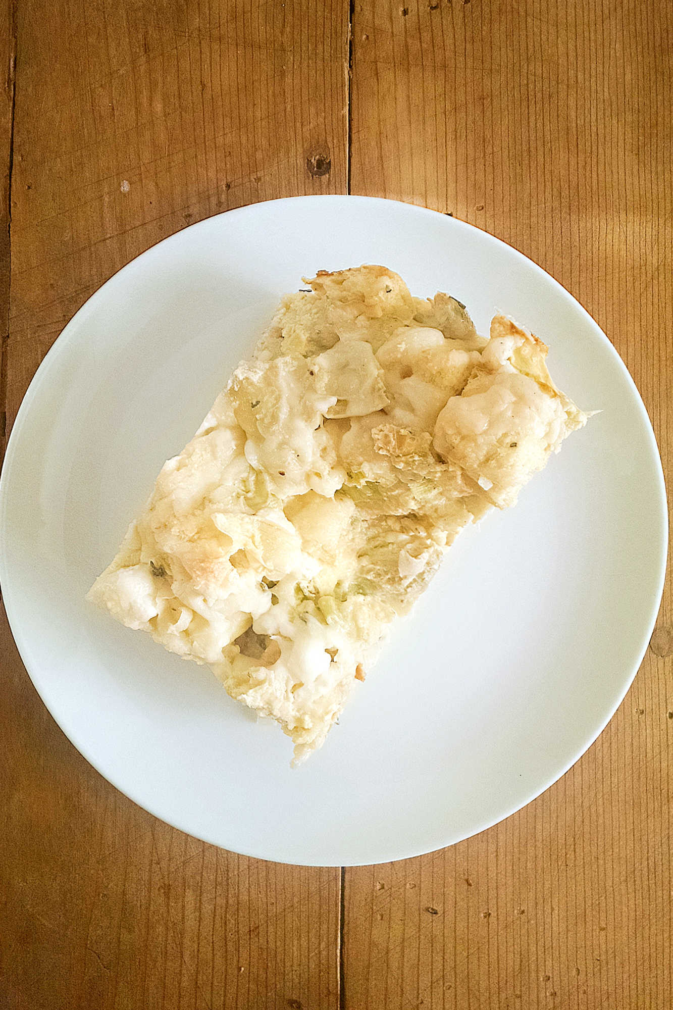 Indulge in the ultimate savory breakfast treat with this Artichoke and Leek Strata! Crispy bread, creamy cheese, and flavorful veggies all in one dish. Brunch goals achieved. #breakfastgoals #savorystrata #artichokeandleek #ArtichokeAndLeekStrata #SavoryBrunchFavorites #EggCasseroleLove #VegetarianBrunchIdeas #EasyMakeAheadMeals