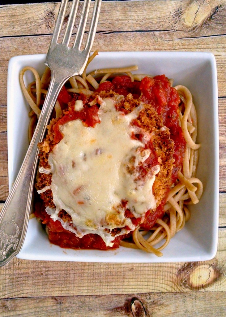 Hearty eggplant is baked with panko until extra crispy. Then it's topped with delicious, roasted tomato marinara and topped with low fat mozzarella cheese and served over whole wheat pasta. This Baked Eggplant Parmesan can't get any more heart healthy.