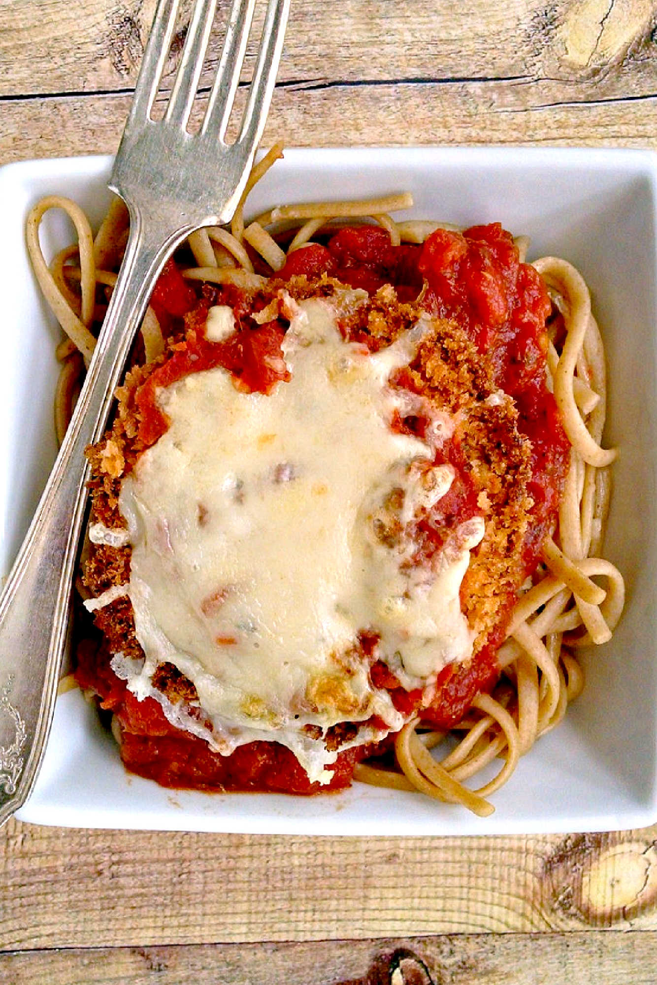 Discover the perfect blend of crispy and cheesy with this mouth-watering Baked Eggplant Parmesan recipe.  It's a great way to sneak in veggies! #eggplant #eggplantParm #Parmrecipe #meatless #meatfree #BakedEggplantParmesan #MeatlessMonday #VegetarianRecipes #HealthyEating #ItalianFoodLove